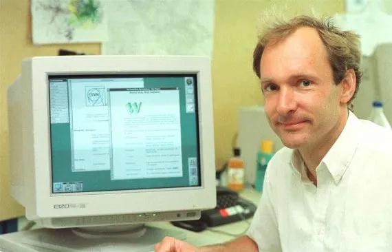 A photo of Tim Berners Lee with his browsers
